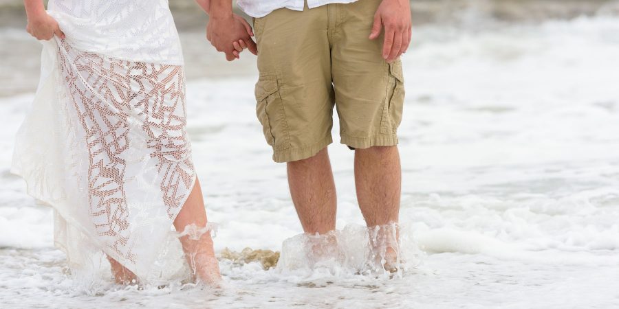 Closeup of water splashing over the couple's feet - Davenport Beach Wedding / Engagement Proposal Photography - Julianna and Brian - photos by Bay Area wedding photographer Chris Schmauch www.GoodEyePhotography.com