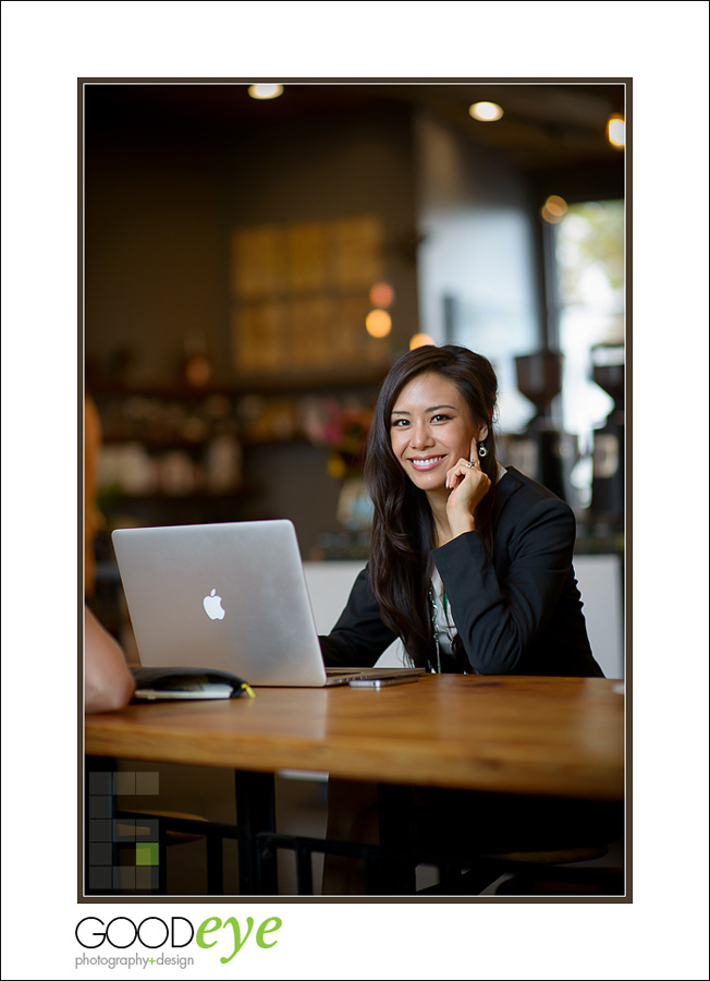 business portrait of attractive asian businesswoman talking on a phone in a coffeeshop