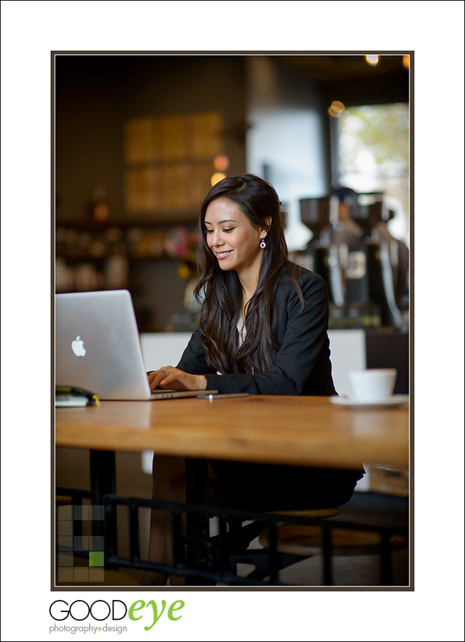 business portrait of attractive asian businesswoman using a laptop in a coffeeshop