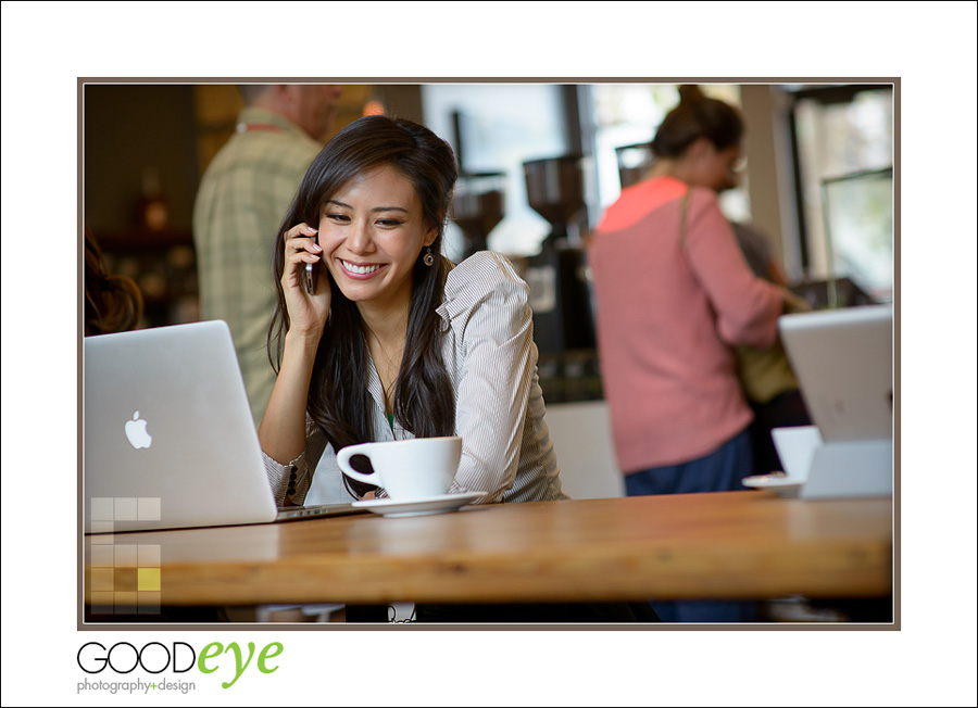 business portrait of attractive asian businesswoman talking on a phone in a coffeeshop