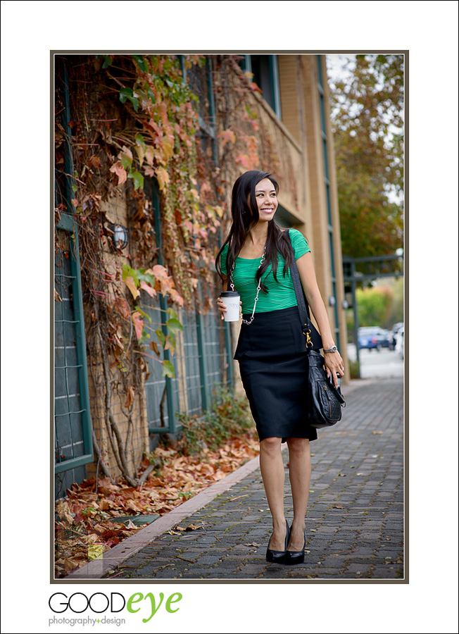 business portrait of attractive asian woman walking outside talking on her smartphone
